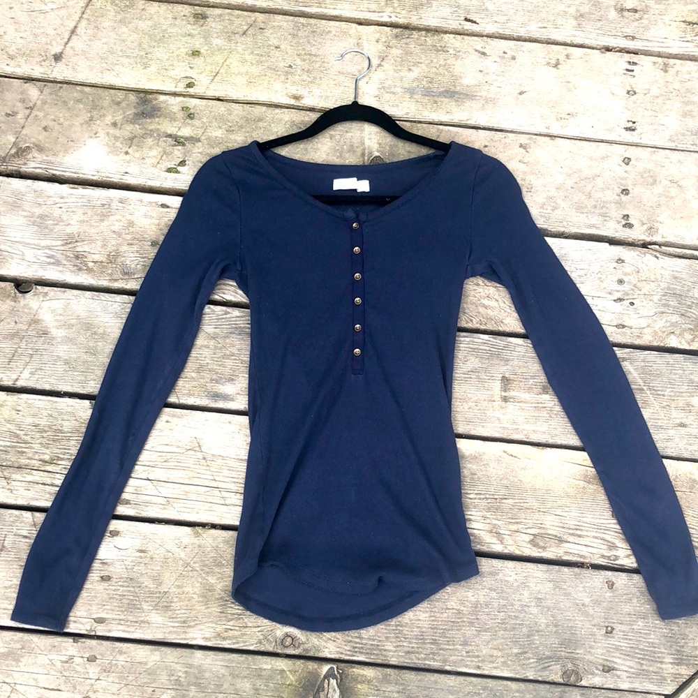 Navy blue, button down, long-sleeved shirt. New condition. No stains or rips.